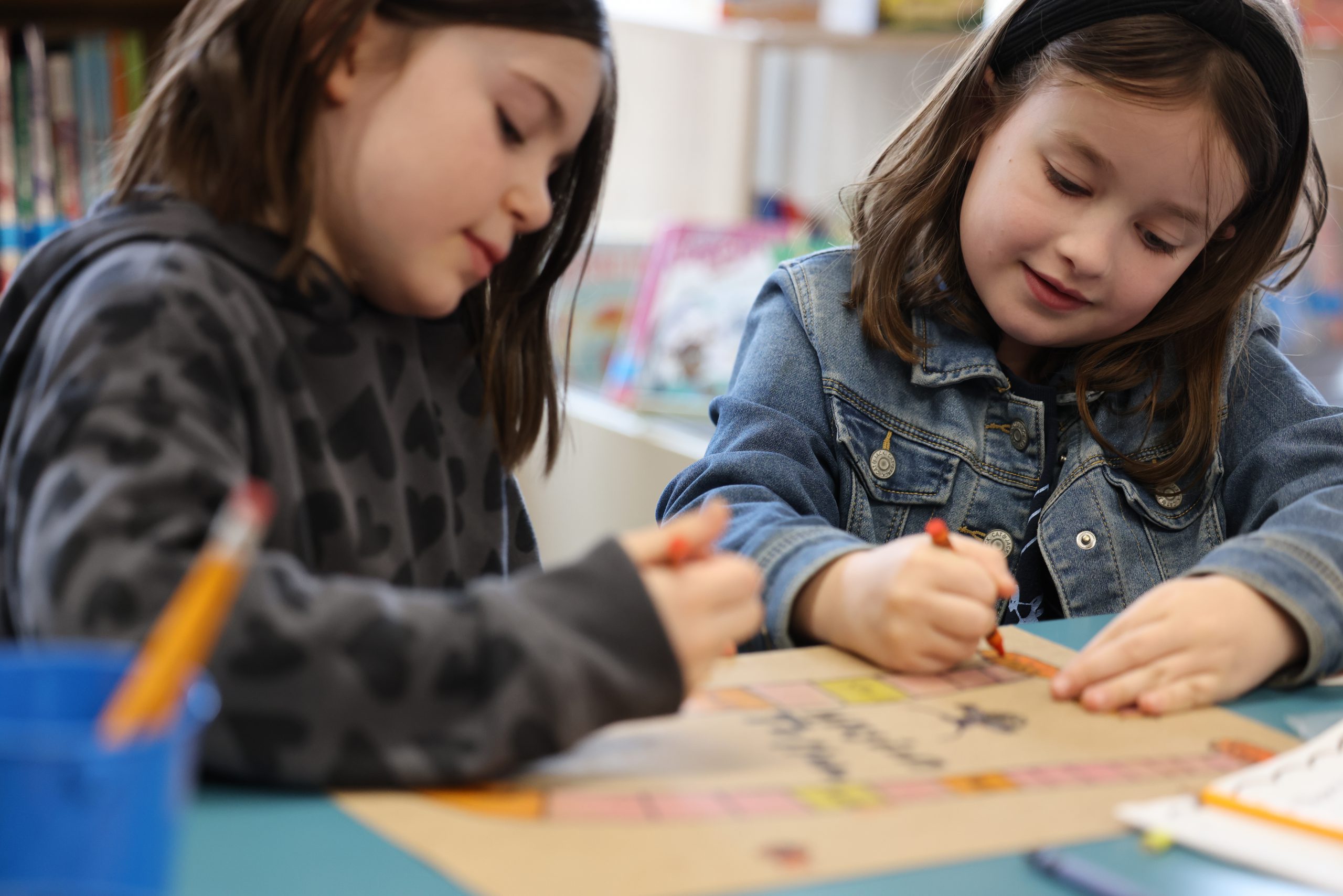 two students coloring