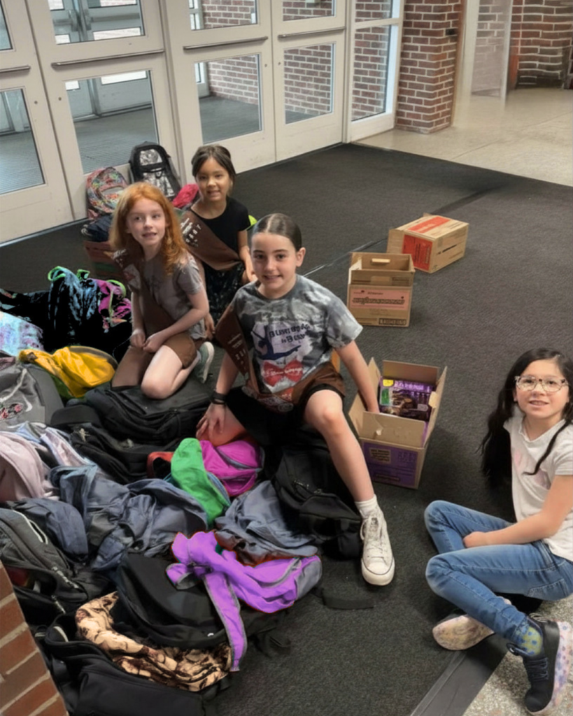 students unload boxes of cookies