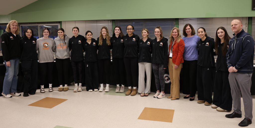 team posing for photo