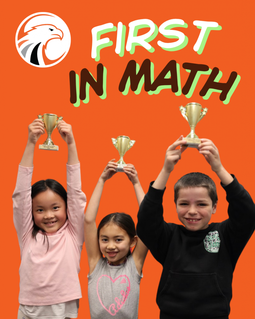 three students hold trophies above their heads