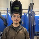 student wearing welding gear