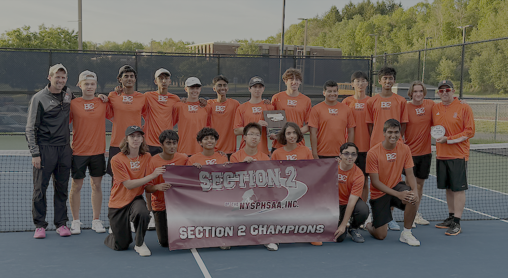 team picture holding banner