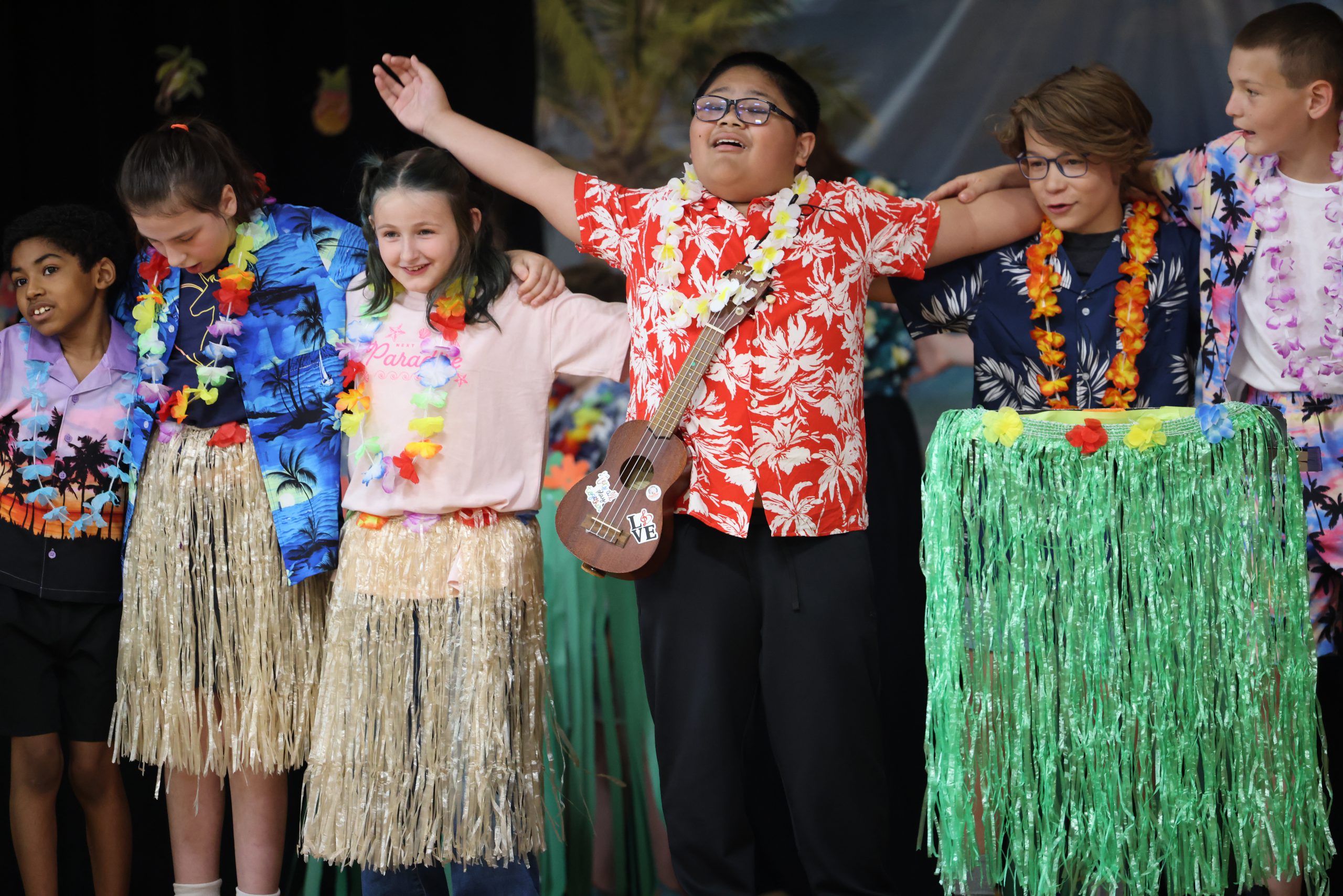students perform on stage