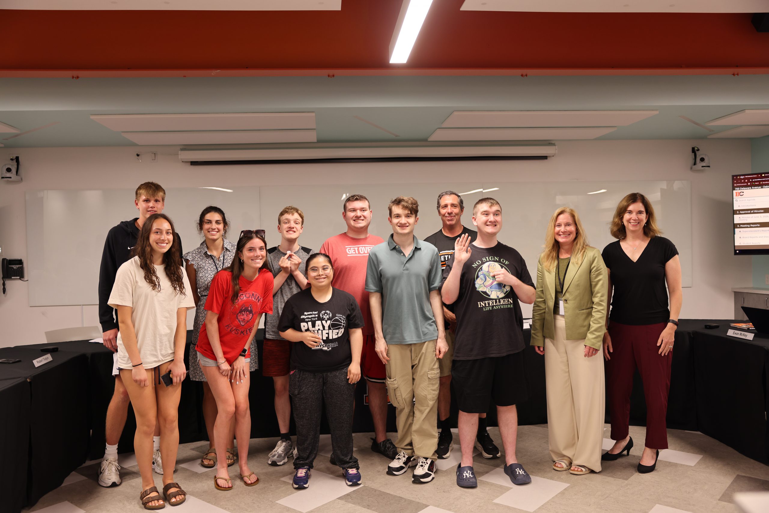 Image of the Unified Basketball team with BOE President Holly Dellenbaugh and Superintendent Jody Monroe