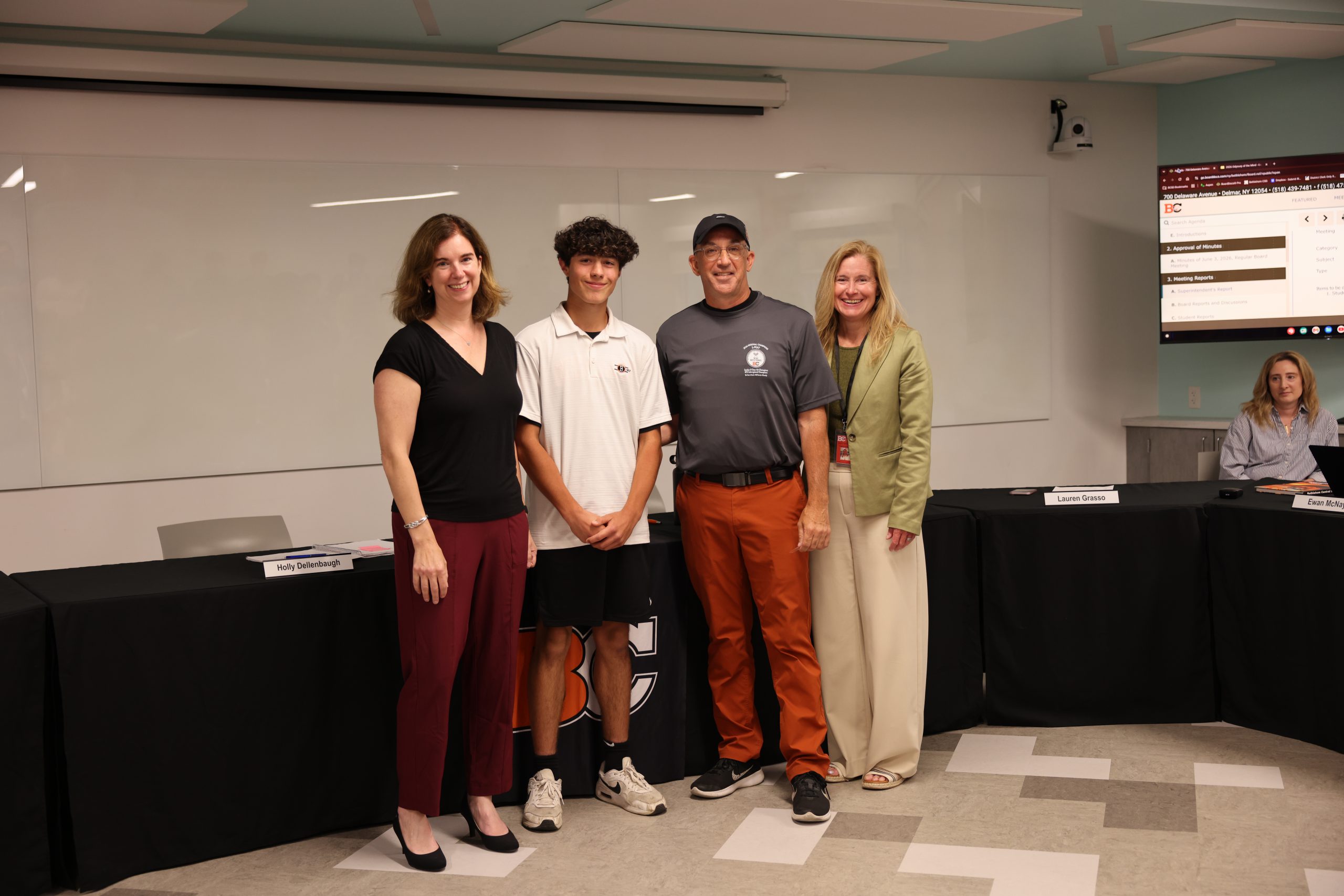 Image of Jonathan Lazarak and Coach Steve Smith with BOE President Holly Dellenbaugh and Superintendent Jody Monroe