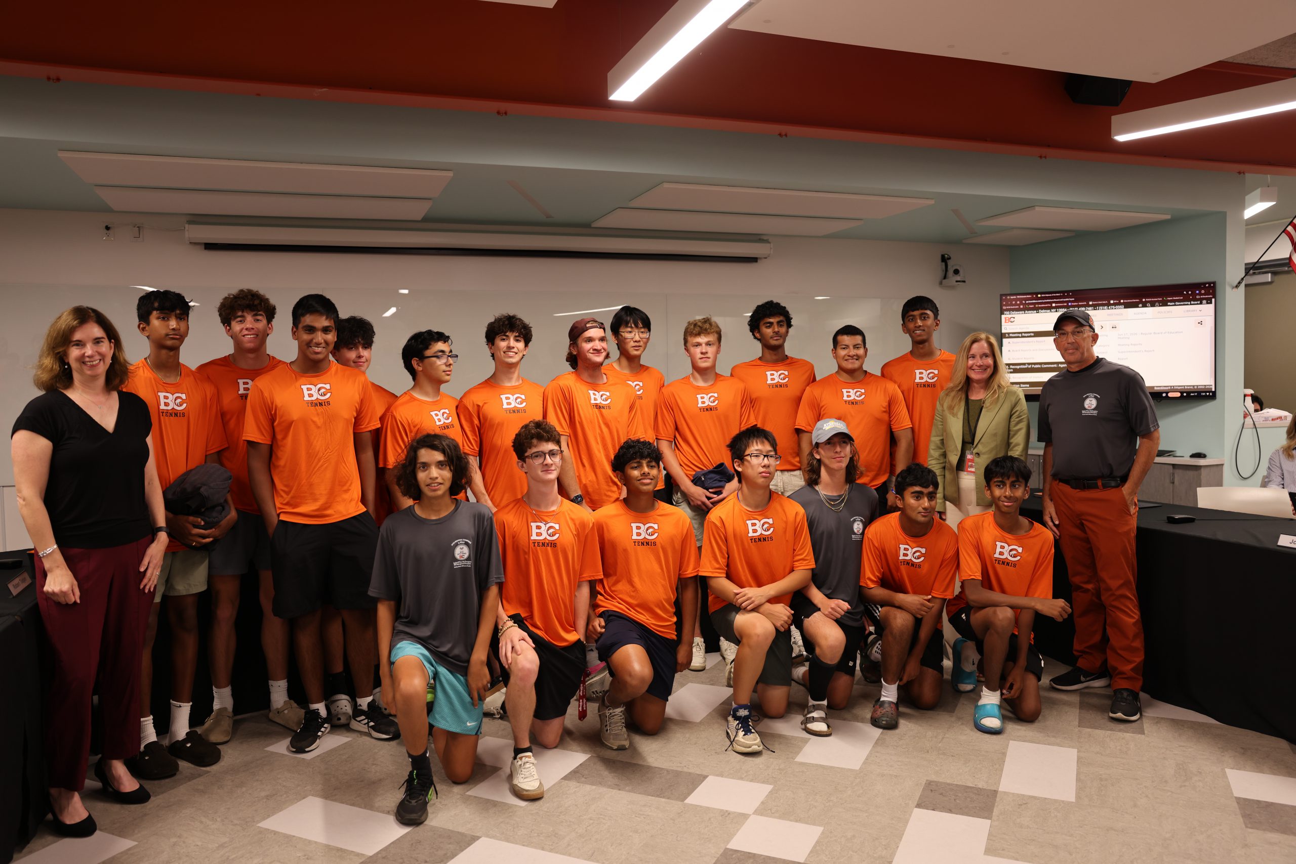 Image of the Boys Tennis Team with BOE President Holly Dellenbaugh and Superintendent Jody Monroe