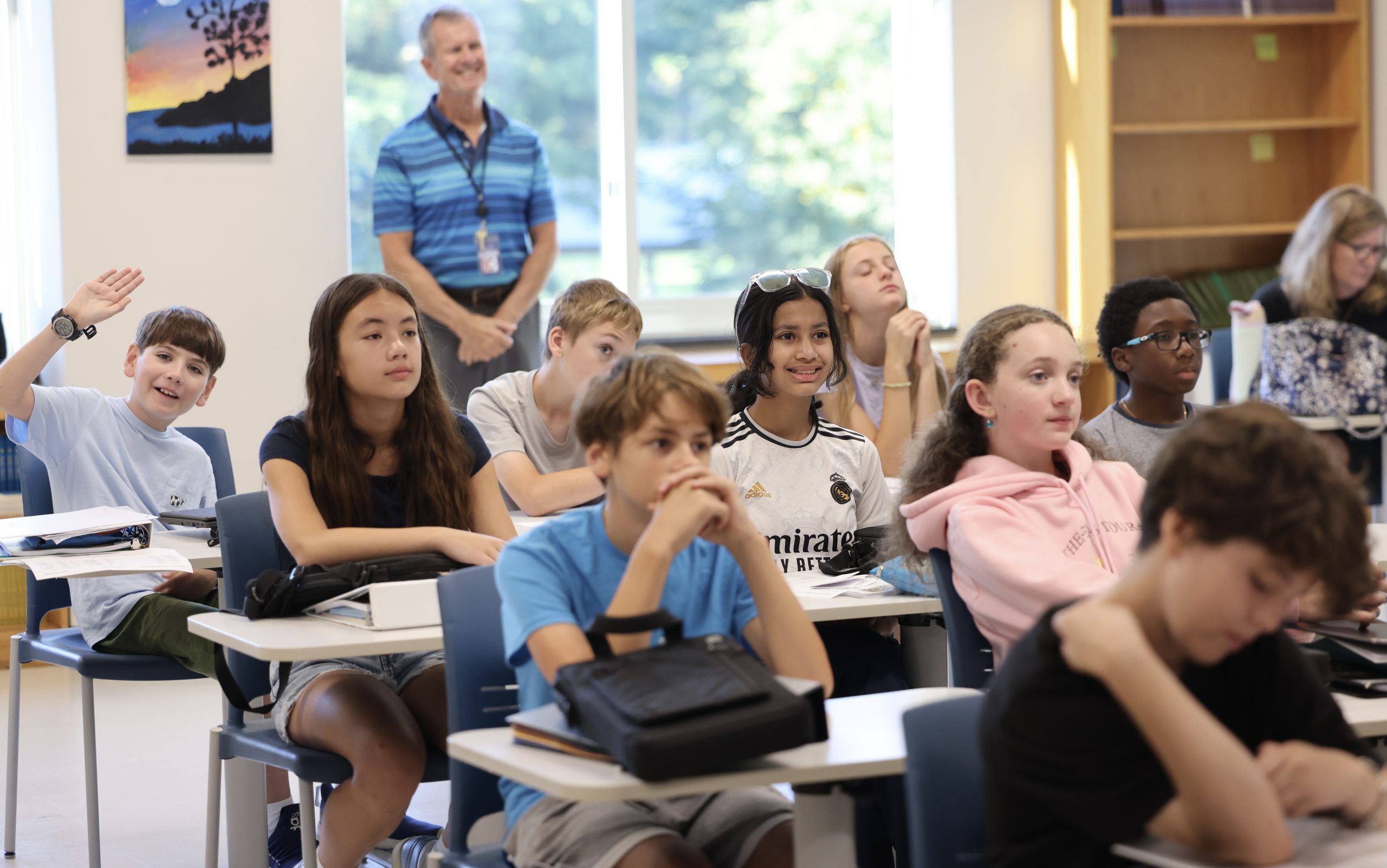 middle school students with teacher