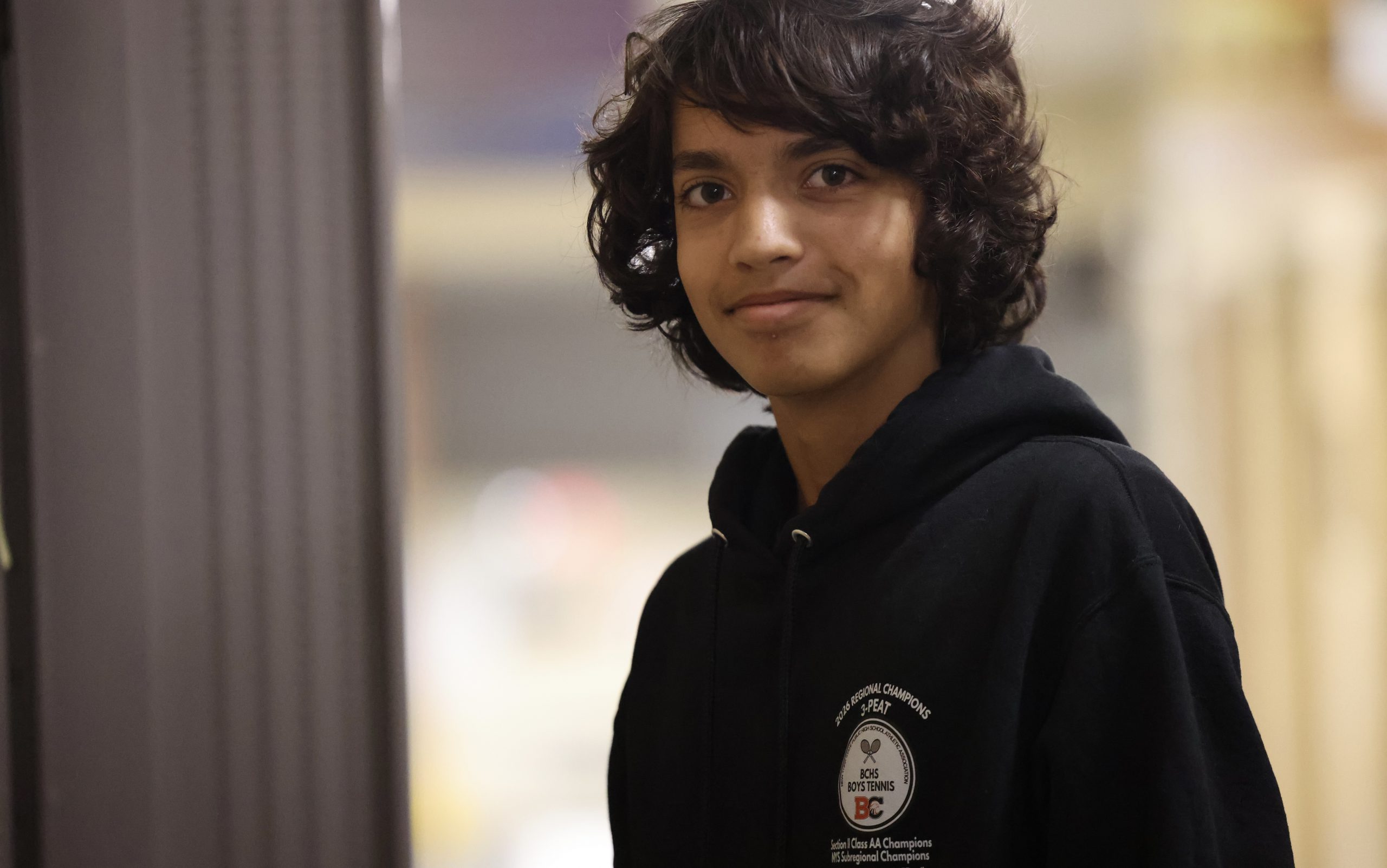 student at locker