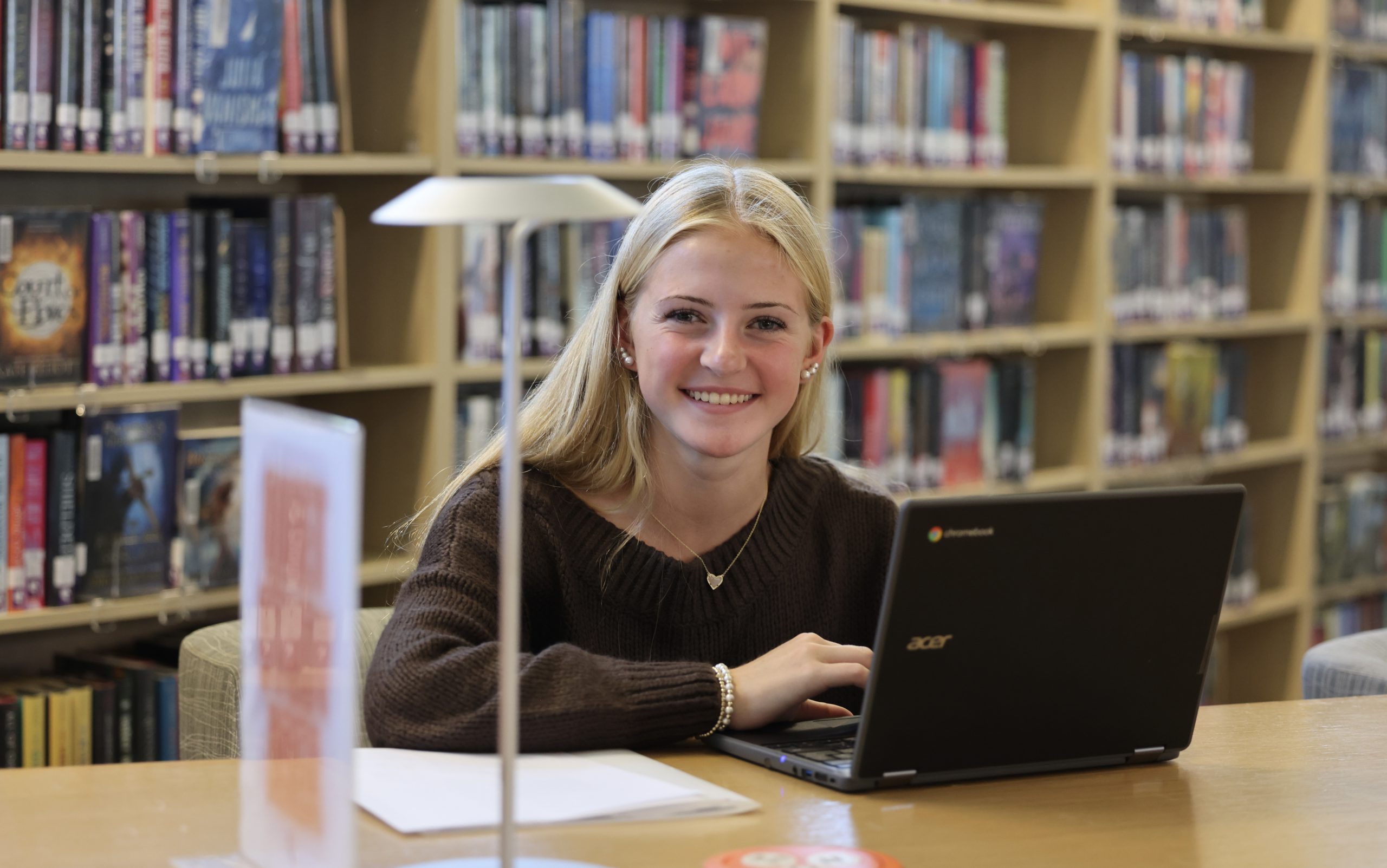 student in library