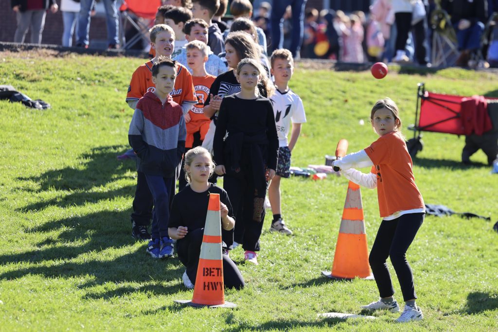 student prepares to swing bat